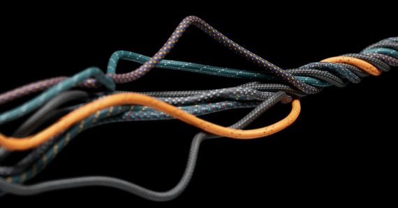 A close up of network cable on a black background, illustrating obsolete enterprise networks