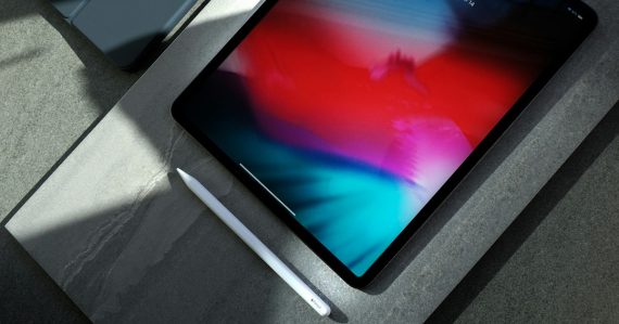 Black iPad with white stylus pen, illustrating enterprise ready tablets