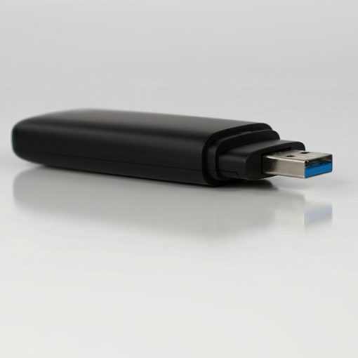 A close up of a usb device on a white surface, illustrating flash memory storage virtualization