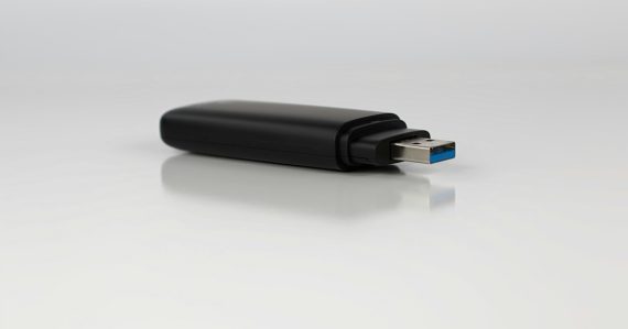 A close up of a usb device on a white surface, illustrating flash memory storage virtualization