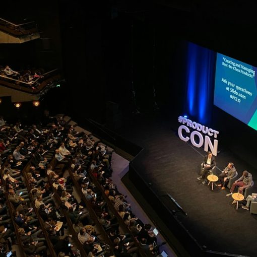 A panel discussion on a stage in a large auditorium with an audience, illustrating Vint Cerf's view of the cloud's future