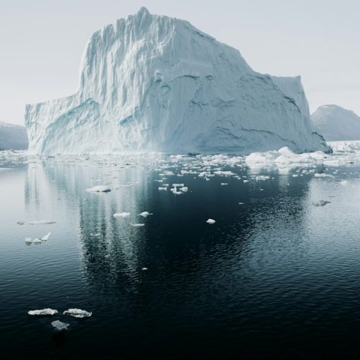 Iceberg floating in cold water, illustrating the hidden costs of cloud computing