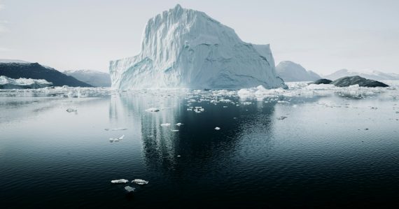 Iceberg floating in cold water, illustrating the hidden costs of cloud computing