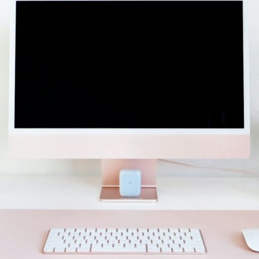 Desktop computer on a clean office desk, illustrating the business benefits of hosted desktops
