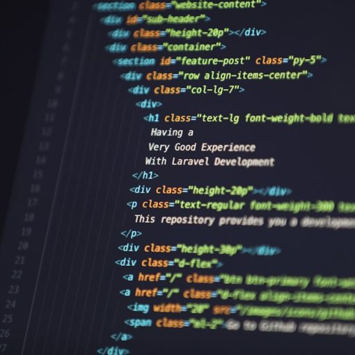 Computer screen displaying HTML code for a web development project, illustrating Hyper-V in Windows 8