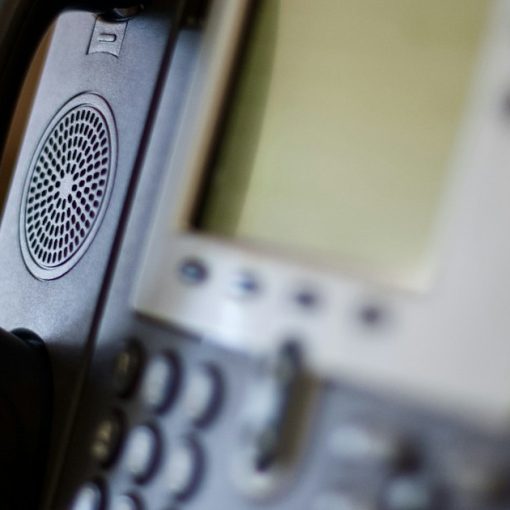 Black and gray ip phone, illustrating IP PBX savings for growing businesses
