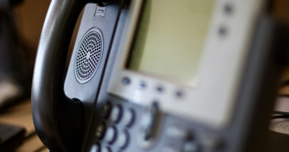 Black and gray ip phone, illustrating IP PBX savings for growing businesses