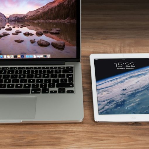 Laptop, tablet and smartphone side by side on a desk, illustrating IT trends shaping 2014 decisions