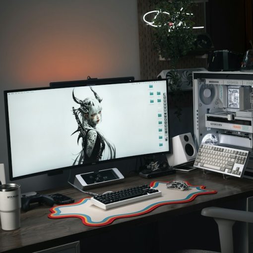 Modern computer setup with large monitor and gaming chair, illustrating meshDESK hosted desktop