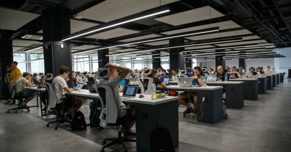 People working in an office, illustrating midmarket cloud computing adoption