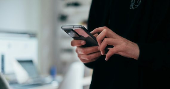 Person holding black android smartphone, illustrating mobile cloud use growth