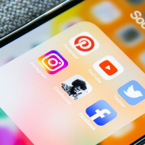 Social media app icons on a smartphone screen with a textured grey background, illustrating a mobile, social, cloud world