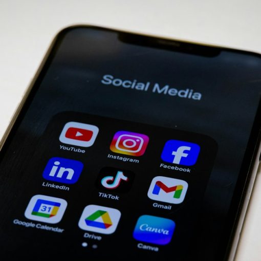 Social media apps displayed on a smartphone, illustrating mobile VoIP growth through social networking