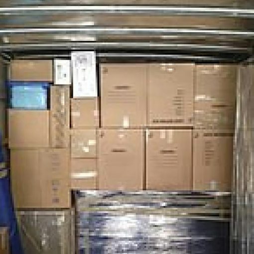 A truck with a bunch of boxes in the back of it, illustrating who will move you to the cloud