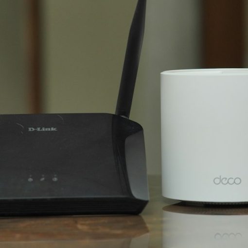 A couple of routers sitting on a table, illustrating preparing your network for the cloud