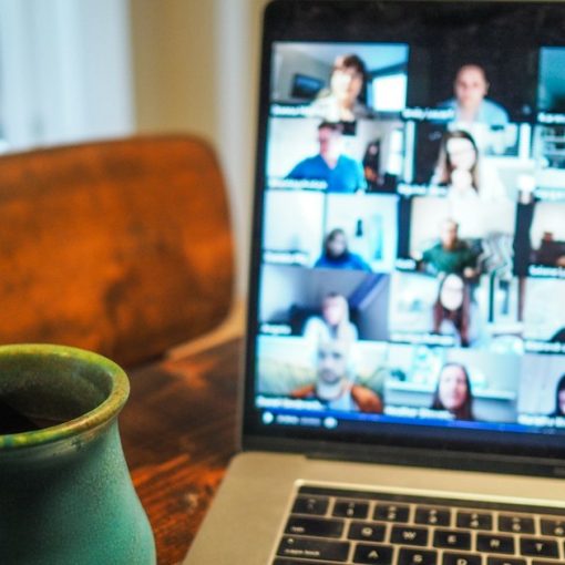 Laptop showing a group video call, illustrating SIP in next-generation communications
