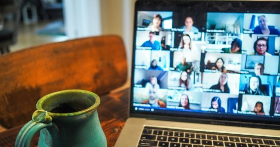 Laptop showing a group video call, illustrating SIP in next-generation communications