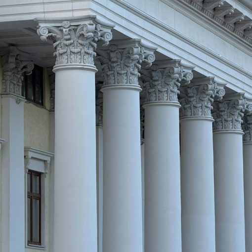 A grand building facade with many white classical columns, illustrating NIST cloud computing standards
