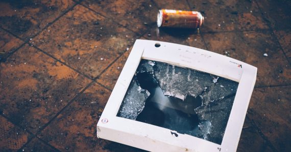 Shattered monitor on the floor, illustrating a Windows patch breaking VMware View