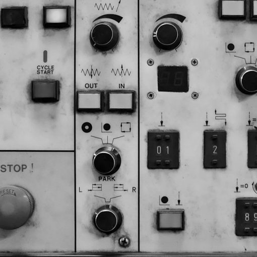 A close up of a control panel with buttons and switches, illustrating cloud control and privacy