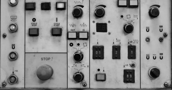 A close up of a control panel with buttons and switches, illustrating cloud control and privacy