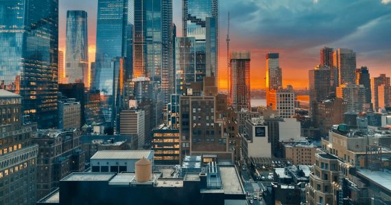 A view of a city at sunset from the top of a building, illustrating public cloud services growth