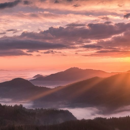 Overlooking view of mountains and sunrise, illustrating cloud computing poised for a breakthrough