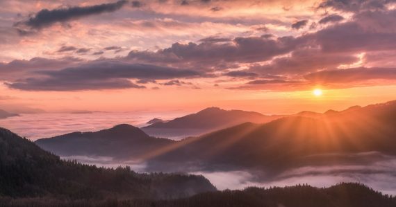 Overlooking view of mountains and sunrise, illustrating cloud computing poised for a breakthrough