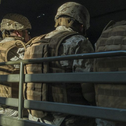 Soldiers in truck, illustrating resilient military cloud infrastructure