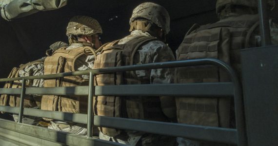 Soldiers in truck, illustrating resilient military cloud infrastructure