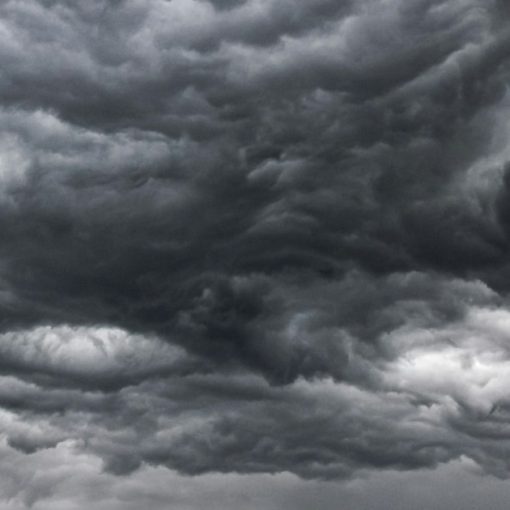 Dark storm clouds in black and white, illustrating rogue clouds giving IT staff nightmares