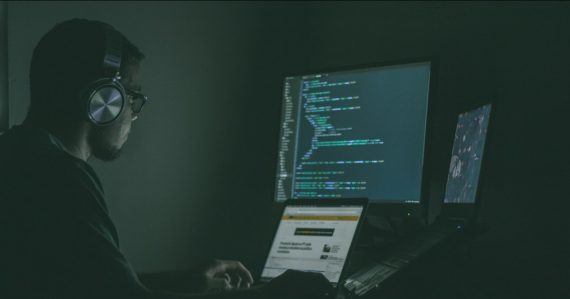 Person using laptop computers, illustrating CIA investment in secure virtualization