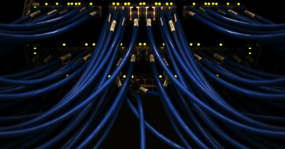A bunch of blue network cables connected to each other, illustrating securing VoIP on enterprise networks