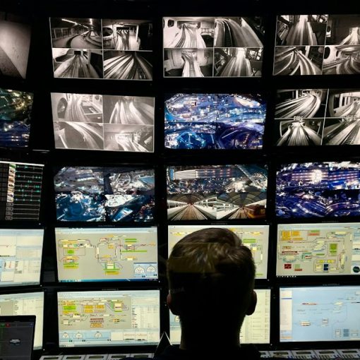 A man sitting in front of multiple monitors, illustrating preparing for the next IT security trend