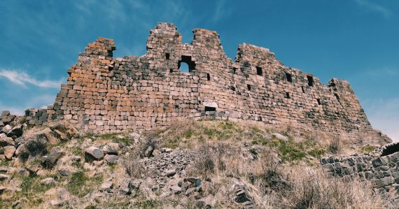 A large stone fortress sitting on top of a hill, illustrating cloud computing security strengths