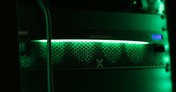 A close up of a green light in a server, illustrating security for sensitive cloud data