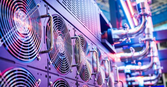 Close-up of server cooling fans in a vibrant data center, illustrating server application virtualization