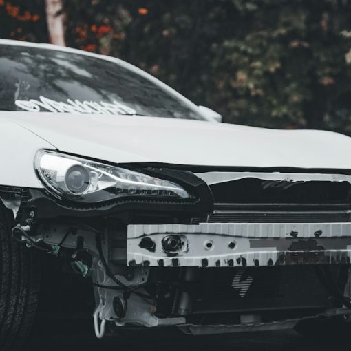 White car with bumper removed outdoors, illustrating stalled server virtualization