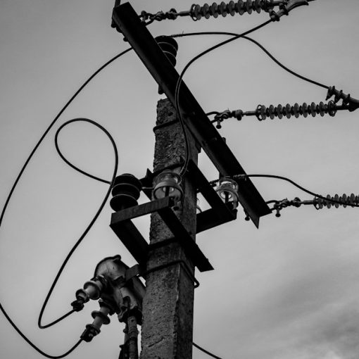 A black and white photo of a power pole, illustrating the current state of cloud computing