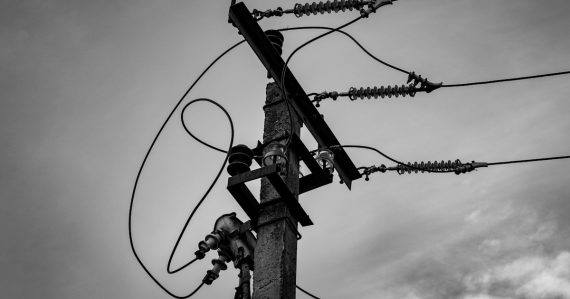 A black and white photo of a power pole, illustrating the current state of cloud computing