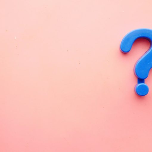 A blue question mark on a pink background, illustrating small business cloud knowledge