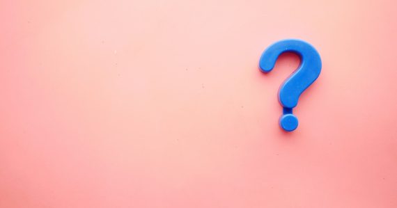 A blue question mark on a pink background, illustrating small business cloud knowledge