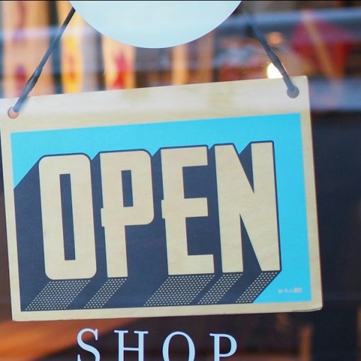 Gray and blue Open signage, illustrating cloud opportunities for SMBs and providers