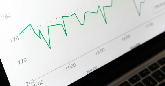 Stock market chart displayed on laptop screen, illustrating increased spending on cloud computing