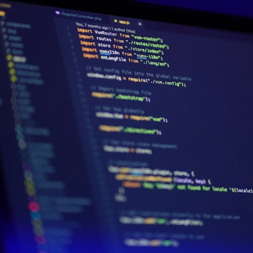Laptop screen displaying colorful code, illustrating SQL Server trends toward cloud and virtualization