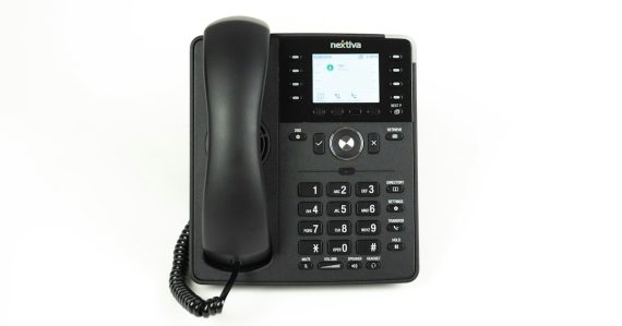 IP desk phone on an office desk, illustrating business VoIP services