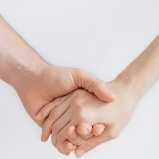 Woman and man holding hands, illustrating trust in cloud computing