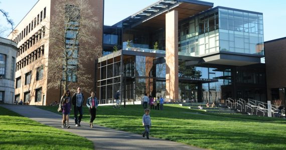People walking near Paccar Hall at the University of Washington, illustrating UT Dallas cloud computing research