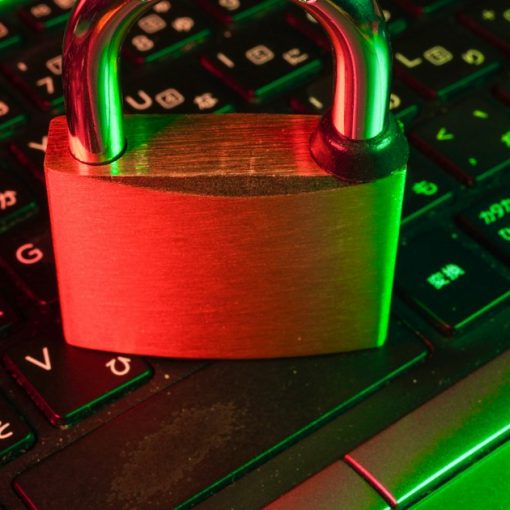 Red padlock on black computer keyboard, illustrating securing the virtual desktop