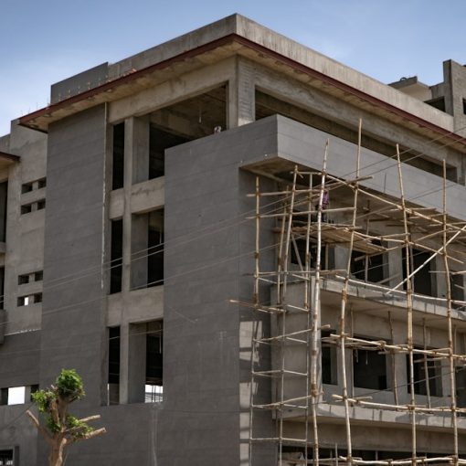 A concrete building under construction with bamboo scaffolding, illustrating virtualization 2.0 for cloud computing